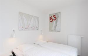 Ein Bett oder Betten in einem Zimmer der Unterkunft Priwallpromenade 2, Whg 4