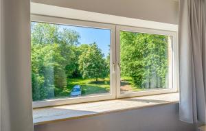 a window with a view of a yard at Stunning Apartment In St Annen in Sankt Annen