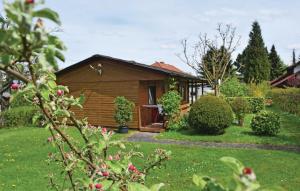 a small wooden cabin in a yard with grass at 2 Bedroom Stunning Home In Oberelbert in Oberelbert