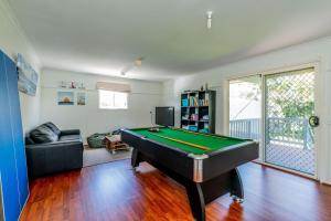 a living room with a pool table in it at EAGLES NEST VIEWS ON TAMARA in Inverloch