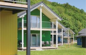 a row of houses with green and yellow at Ferienhausdorf Thale in Thale +33 photos