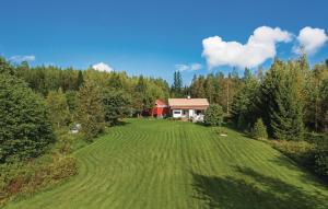 an aerial view of a house in the middle of a field at Cozy Home In Östra Ämtevik With Sauna in Östra Ämtervik
