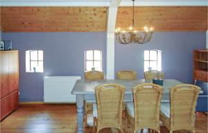 a dining room with a table and chairs at 2 Bedroom Gorgeous Home In Smilde in Smilde