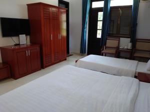 Postel nebo postele na pokoji v ubytování Resort Hoa Sim Da Lat