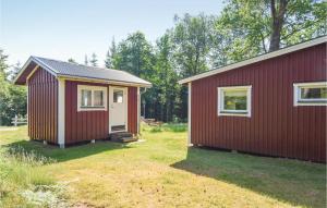 two tiny houses sitting next to each other at Amazing Home In Stenkullen With 1 Bedrooms And Wifi in Stenkullen