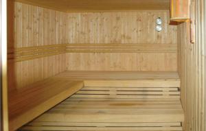 a wooden sauna with a wooden floor and a wooden at Lovely Home In Gerolstein With Wifi in Gerolstein +20 photos