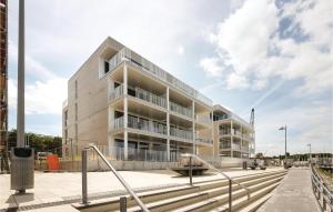 an apartment building with a staircase in front of it at Priwallpromenade 3, Whg 2 in Priwall