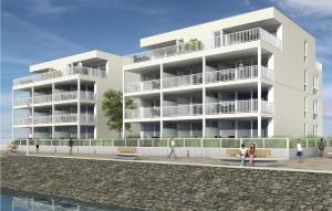 a rendering of a building with people walking in front of it at Priwallpromenade 3, Whg 2 in Priwall