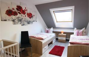 a small bedroom with two beds and a window at Lovely Apartment In Marienmnster With Sauna in Schieder-Schwalenberg