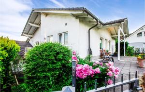 a white house with pink flowers in front of it at Beautiful Home In Lennestadt With 3 Bedrooms And Wifi in Lennestadt