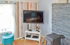 a living room with a flat screen tv on a wall at Gorgeous Home In Hovland With Wifi in Espe
