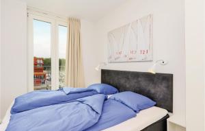 Ein Bett oder Betten in einem Zimmer der Unterkunft Passatvilla - Apartment 6