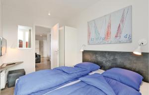 Ein Bett oder Betten in einem Zimmer der Unterkunft Passatvilla - Apartment 6