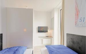 Ein Bett oder Betten in einem Zimmer der Unterkunft Passatvilla - Apartment 6