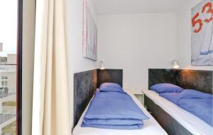 Ein Bett oder Betten in einem Zimmer der Unterkunft Passatvilla - Apartment 6