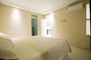 Postel nebo postele na pokoji v ubytování Porto das Dunas Casa Temporada Estilo e Conforto