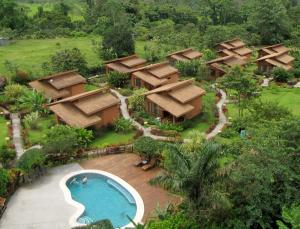 an aerial view of a resort with a swimming pool at Hotel El Silencio del Campo in Fortuna