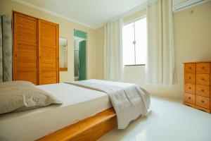 Postel nebo postele na pokoji v ubytování Porto das Dunas Casa Temporada Estilo e Conforto