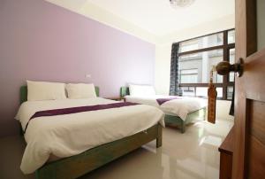 Postelja oz. postelje v sobi nastanitve Yilan B&B - Happy Snail