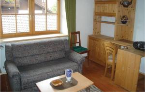 a living room with a couch and a table at Cozy Apartment In Ehrwald With House A Mountain View in Ehrwald