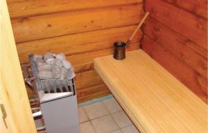 a small room with a bed and a broom at Holiday Home Flå Øvre Reinsjøfjell in Stamn