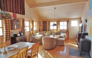 a living room with a couch and a table at 5 Bedroom Amazing Home In Geilo in Geilo