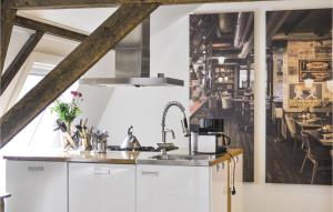 a kitchen with white cabinets and a sink at 3 Bedroom Pet Friendly Home In Leende in Leende +13 photos