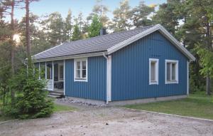 a small blue house with white windows at 3 Bedroom Stunning Home In Slite in Slite