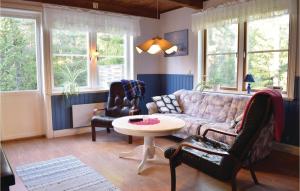 a living room with a couch and two chairs and a table at 3 Bedroom Stunning Home In Slite in Slite
