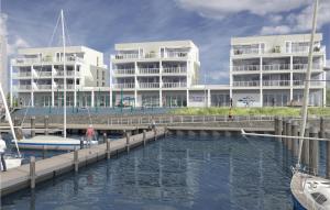 una rappresentazione di un porto turistico con edifici sullo sfondo di Priwallpromenade 29, Whg 13 a Travemünde