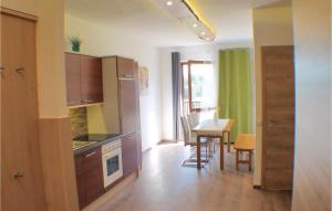a kitchen with a table and a dining room at Awesome Apartment In Ertl With Wifi in Buchschachen
