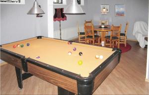 a room with a pool table and a dining room at 3 Bedroom Cozy Home In Vimmerby in Vimmerby