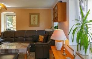 a living room with a couch and a table at Pet Friendly Apartment In Freiberg in Freiberg