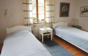Säng eller sängar i ett rum på Stunning Home In Trans With 3 Bedrooms