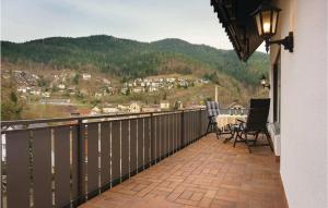 a balcony of a house with a table and chairs at Awesome Apartment In Hornberg With 2 Bedrooms And Wifi in Hornberg