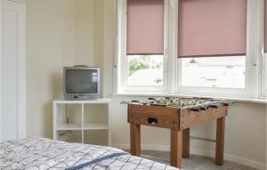 a room with a chess board in front of a window at Vwa De Panne in Adinkerke