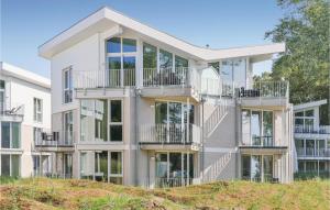 an apartment building with balconies on a hill at Dünenvilla 9, Whg 3 in Travemünde