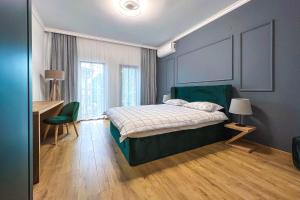מיטה או מיטות בחדר ב-Deluxe Central Rooms