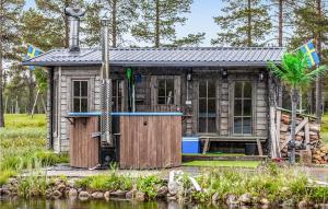 a tiny house next to a body of water at 2 Bedroom Gorgeous Home In Arvidsjaur in Arvidsjaur