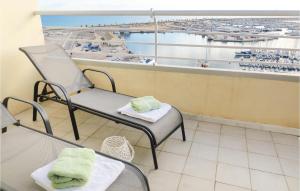 a room with a chair and a view of an airport at Cozy Apartment In Torrevieja in Torrevieja
