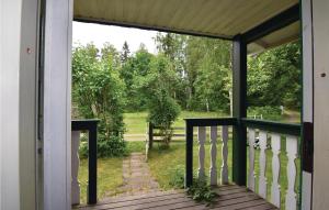 a screened porch with a view of a yard at 2 Bedroom Cozy Home In Sjötorp in Sjötorp