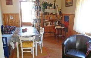 a dining room with a table and chairs at 3 Bedroom Awesome Home In Srna in Särna