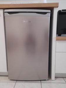 een witte koelkast in een keuken onder een aanrecht bij Central Studio 2 in Heraklion
