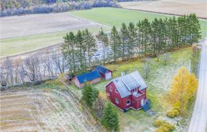 an aerial view of a red house in a field at Nice Home In Gjra With 2 Bedrooms And Wifi in Musgjerd