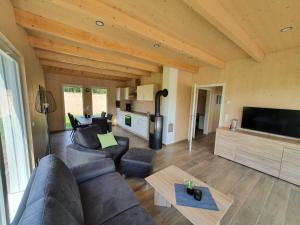 a living room with a couch and a table at Ferienhäuser Prüm in Prüm