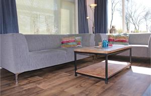 a living room with a couch and a coffee table at Wijde Waddenzee in Den Oever