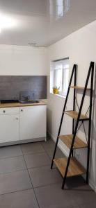 Kuchyňa alebo kuchynka v ubytovaní Appartement en duplex à Hébuterne, avec lave linge