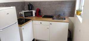 Kuchyňa alebo kuchynka v ubytovaní Appartement en duplex à Hébuterne, avec lave linge