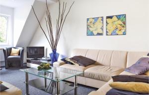a living room with a couch and a glass table at Pet Friendly Apartment In Bad Berleburg-bergh, With Kitchen in Bad Berleburg