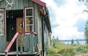 an outside view of a small house with a door at Gorgeous Home In Särna With Sauna in Ringbo +15 photos